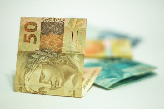 pexels-photo-7624066-7624066 Brazilian Real banknotes in focus with 50 denomination displayed prominently.